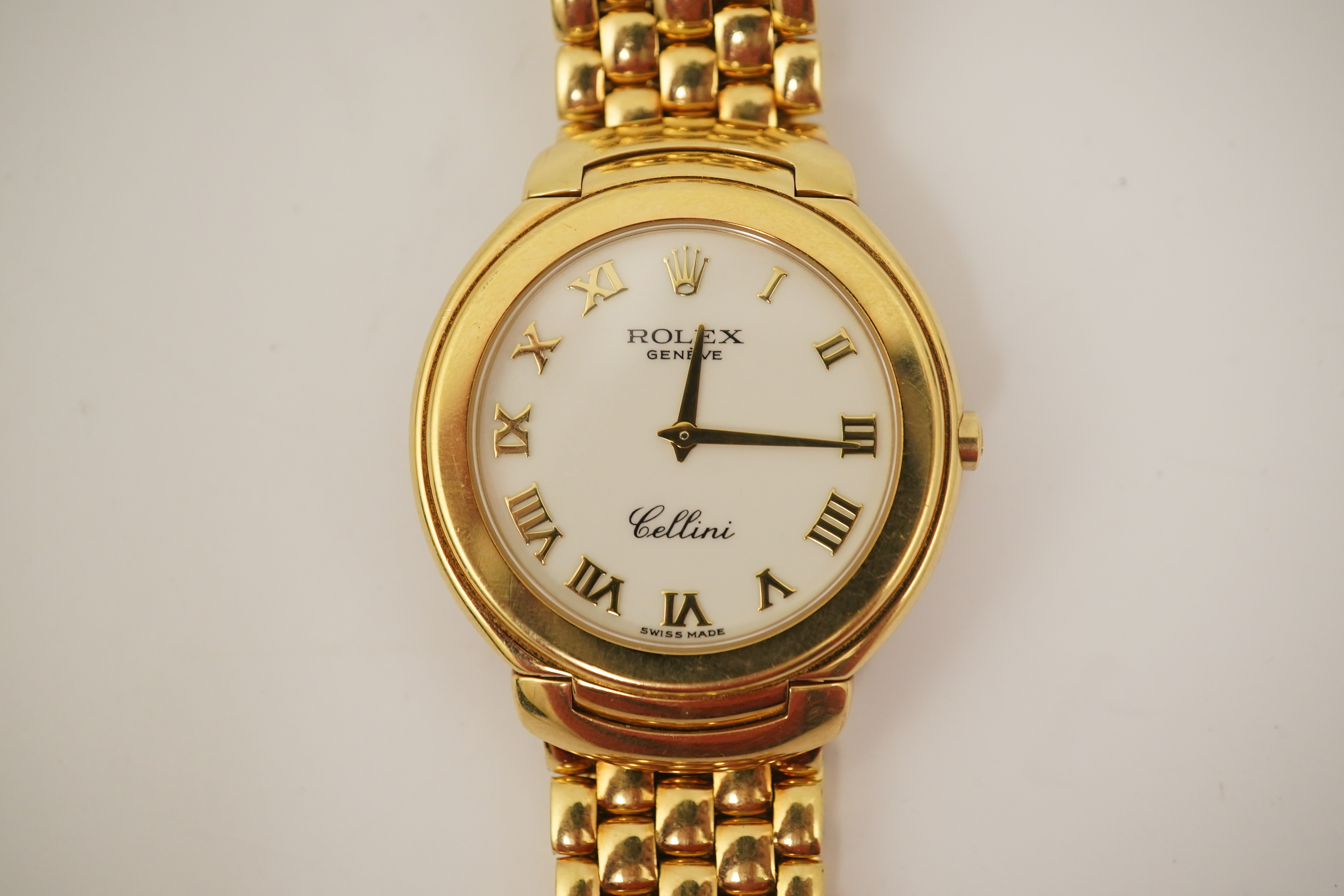 A gentleman's 1990's 18ct gold Rolex Cellini quartz dress wrist watch, on an 18ct gold Rolex brick link bracelet, with deployment clasp